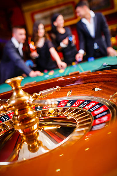 Live Roulette dealer studio with wheel and betting layout